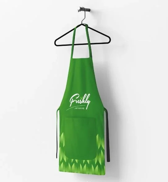 Green Freshly apron with the white logo and a leaf pattern along the hem