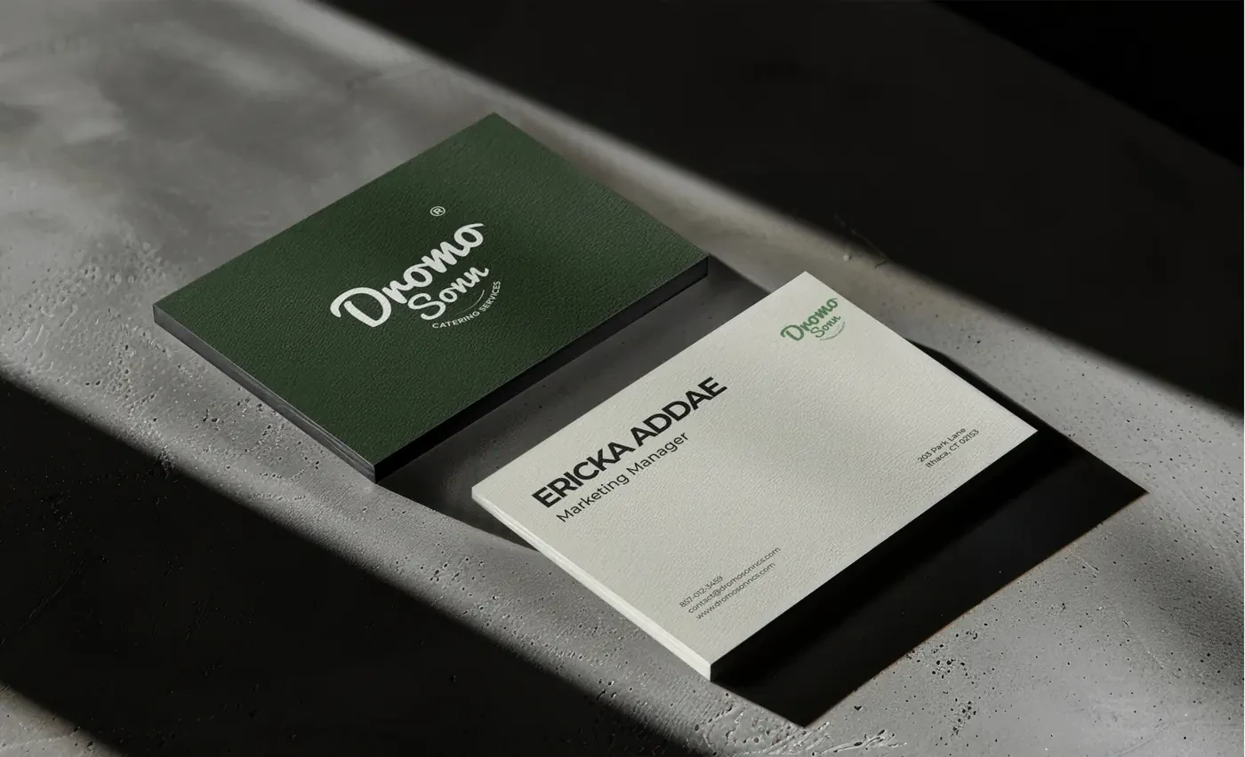 Two Dromo Sonn business cards, one branded green and one for Marketing Manager Ericka Addae
